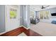 Cozy living room featuring a comfortable gray sofa, hardwood floors and bright natural light at 429 Argonne Ter, Canton, GA 30115
