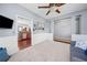 Living room with wood floors and carpet, light gray walls, and seamless transition to kitchen and dining at 429 Argonne Ter, Canton, GA 30115