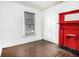 Bedroom featuring a large window, fireplace, and hardwood floors at 814 Welch Sw St, Atlanta, GA 30310
