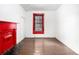 Bedroom features painted hardwood floors and natural light from single window at 814 Welch Sw St, Atlanta, GA 30310