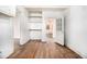 View of a spacious, sunlit room with hardwood floors and shelving at 814 Welch Sw St, Atlanta, GA 30310