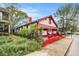 Charming home with white and red exterior, awning, and landscaped front yard at 814 Welch Sw St, Atlanta, GA 30310