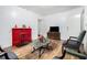 Classic living room with bright light from window and a beautiful red fireplace at 814 Welch Sw St, Atlanta, GA 30310