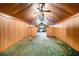 Spacious living room featuring wood paneling and a ceiling fan for comfortable living at 814 Welch Sw St, Atlanta, GA 30310