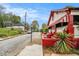 Charming home with white and red exterior, awning, landscaped front yard, and tree lined street at 814 Welch Sw St, Atlanta, GA 30310