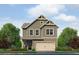 Charming two-story home with attached garage, manicured landscaping, and neutral siding at 1250 Riverstone Rd, Jonesboro, GA 30238
