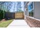 Backyard features fenced yard with small patio and grass at 1600 Ruskin Way, Marietta, GA 30062