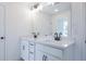 Bathroom featuring double sink vanity with white cabinets, black hardware and large mirror at 1600 Ruskin Way, Marietta, GA 30062