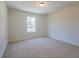 Carpeted bedroom with one window and neutral colored walls at 1600 Ruskin Way, Marietta, GA 30062