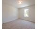 Carpeted bedroom with one window and neutral colored walls at 1600 Ruskin Way, Marietta, GA 30062