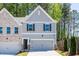 Charming two-story home with a gray exterior, attached garage, and well-maintained landscaping at 1600 Ruskin Way, Marietta, GA 30062