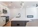 Modern kitchen with stainless steel appliances, quartz countertops, and pendant lighting at 1600 Ruskin Way, Marietta, GA 30062