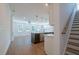 Open-concept living room and kitchen with island at 1600 Ruskin Way, Marietta, GA 30062