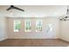 Bright and airy living space featuring hardwood floors and natural light from large windows at 1600 Ruskin Way, Marietta, GA 30062