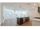 Open-concept layout with modern kitchen island, stainless steel appliances, and spacious living area at 1600 Ruskin Way, Marietta, GA 30062