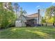 Beautiful backyard with a spacious deck and a charming black fence at 2442 Lower Union Hill Rd, Canton, GA 30115