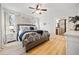 Primary bedroom featuring ample natural light, a ceiling fan, and an ensuite bathroom at 2442 Lower Union Hill Rd, Canton, GA 30115