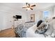 Bright primary bedroom featuring light-colored walls, a ceiling fan, and large windows at 2442 Lower Union Hill Rd, Canton, GA 30115