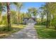 Charming home with a long driveway and a well-manicured front yard at 2442 Lower Union Hill Rd, Canton, GA 30115