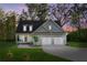 Inviting home exterior with a covered porch and a two-car garage at 2442 Lower Union Hill Rd, Canton, GA 30115