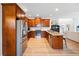 Modern kitchen featuring stainless steel appliances, granite countertops, and wood cabinets at 2442 Lower Union Hill Rd, Canton, GA 30115