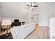 Comfortable living room featuring hardwood floors, a beige couch and a stylish ceiling fan at 2442 Lower Union Hill Rd, Canton, GA 30115