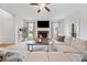 Cozy living room featuring a stone fireplace and hardwood floors at 2442 Lower Union Hill Rd, Canton, GA 30115