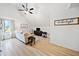 Bright living room area featuring a white couch, hardwood floors, vaulted ceiling and decorative wall decor at 2442 Lower Union Hill Rd, Canton, GA 30115