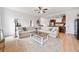 Open-concept living room with ample seating and natural light at 2442 Lower Union Hill Rd, Canton, GA 30115