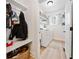 Mud room with storage, coat hooks, a bench, and a view to the laundry room at 2442 Lower Union Hill Rd, Canton, GA 30115
