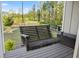 Relax on the charming porch swing overlooking the pond at 2442 Lower Union Hill Rd, Canton, GA 30115