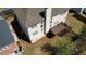A view of the home from above, showcasing a wooden deck with stairs and surrounding greenery at 2688 Autumn Ridge Ln, Lawrenceville, GA 30044