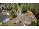 Aerial view of homes in a suburban neighborhood with manicured lawns and mature trees at 2688 Autumn Ridge Ln, Lawrenceville, GA 30044