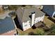 An aerial view captures the home and wooden deck, highlighting the backyard layout at 2688 Autumn Ridge Ln, Lawrenceville, GA 30044