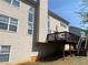 Backyard view of exterior elevation, deck, and patio at 2688 Autumn Ridge Ln, Lawrenceville, GA 30044