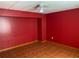 Finished basement area with ceramic tile floors and a red painted wall at 2688 Autumn Ridge Ln, Lawrenceville, GA 30044