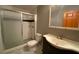Cozy bathroom with enclosed shower, checkered tile and single sink vanity at 2688 Autumn Ridge Ln, Lawrenceville, GA 30044