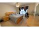 Neutral bedroom featuring a bed, wooden furniture, curtains, and neutral paint scheme at 2688 Autumn Ridge Ln, Lawrenceville, GA 30044
