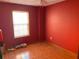 Bedroom with terracotta tile and bright sunlight with bold red paint at 2688 Autumn Ridge Ln, Lawrenceville, GA 30044
