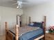 Bright bedroom featuring a traditional four-poster bed and neutral paint scheme at 2688 Autumn Ridge Ln, Lawrenceville, GA 30044