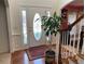 Inviting foyer featuring a decorative front door, hardwood floors, and a staircase leading to the upper level at 2688 Autumn Ridge Ln, Lawrenceville, GA 30044