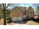 Charming two-story brick home with a two-car garage and well-manicured landscaping at 2688 Autumn Ridge Ln, Lawrenceville, GA 30044