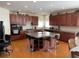Spacious kitchen with a large island, hardwood floors and dark wood cabinets at 2688 Autumn Ridge Ln, Lawrenceville, GA 30044
