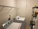 Bright laundry room with modern appliances and shelving for ample storage at 2688 Autumn Ridge Ln, Lawrenceville, GA 30044