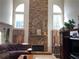High ceiling living room with stone fireplace, hardwood floors and plenty of light at 2688 Autumn Ridge Ln, Lawrenceville, GA 30044