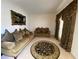 Living room featuring two sofas, an area rug and decorative window coverings at 2688 Autumn Ridge Ln, Lawrenceville, GA 30044