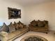 Living room with two sofas, decorative rug, and ornate wall art at 2688 Autumn Ridge Ln, Lawrenceville, GA 30044