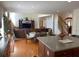 Open-concept living room featuring a large TV, comfortable seating, and seamless flow from the kitchen at 2688 Autumn Ridge Ln, Lawrenceville, GA 30044