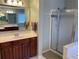 This bathroom includes a separate glass shower, soaking tub, and vanity at 2688 Autumn Ridge Ln, Lawrenceville, GA 30044