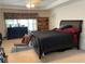 A comfortable bedroom showcasing carpeted floors, a dresser, and a ceiling fan at 2688 Autumn Ridge Ln, Lawrenceville, GA 30044